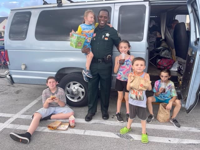 officer with the kids who are homeless